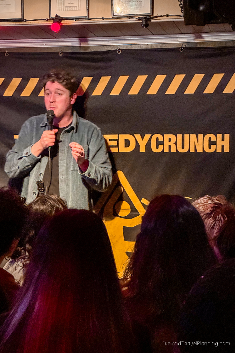 Comedian on stage at Comedy Crunch Dublin, a free Dublin activity.