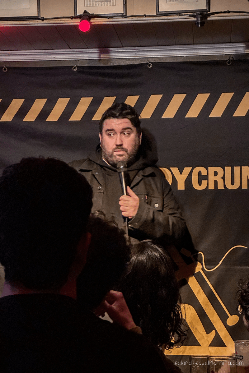 Comedian performing at a free comedy show in Dublin