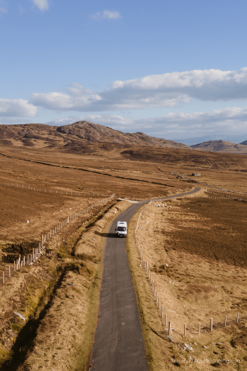 Campervan on a winding road through rural Ireland, travel tip