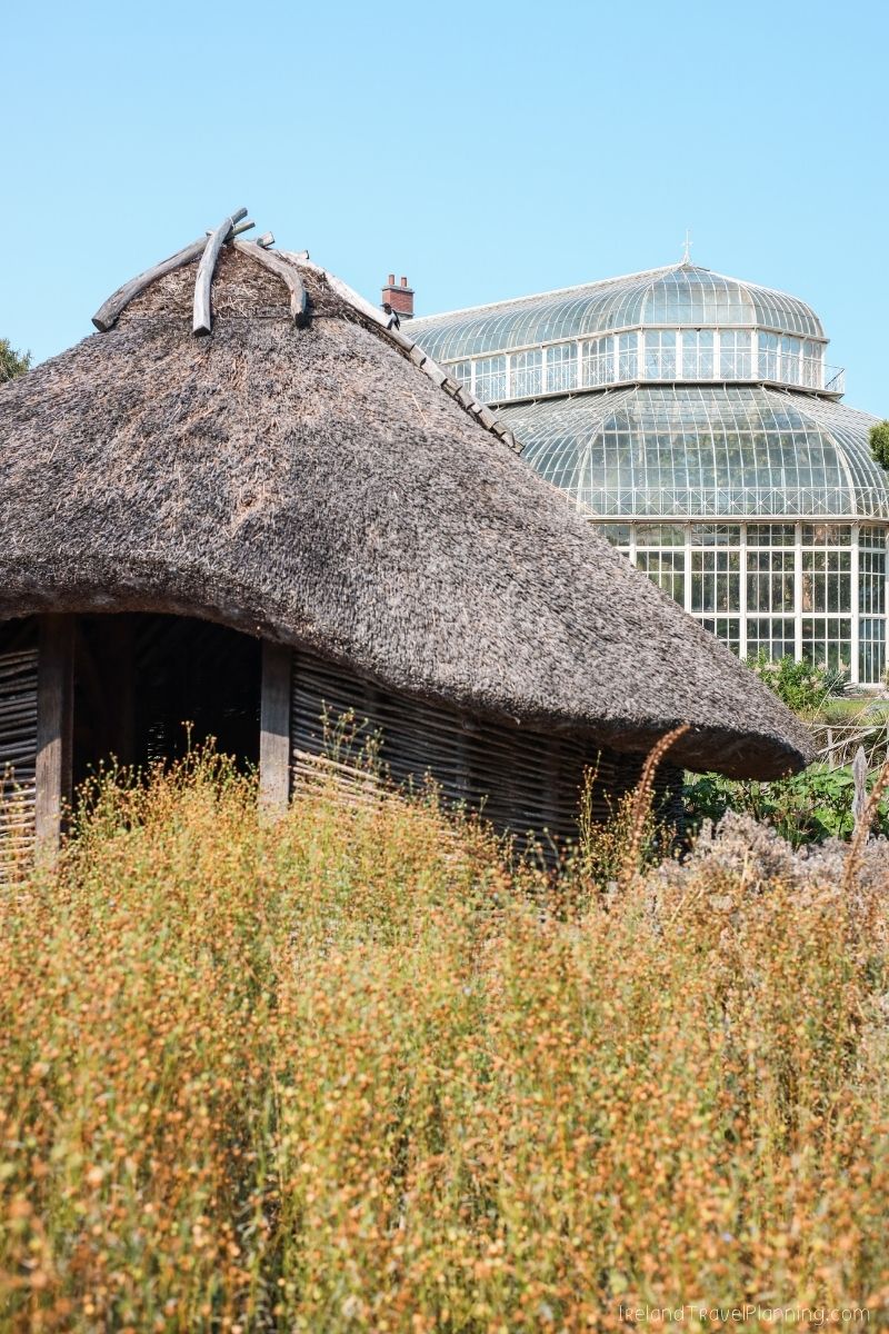 Thatched roof building and glasshouses in Dublin, a free attraction.