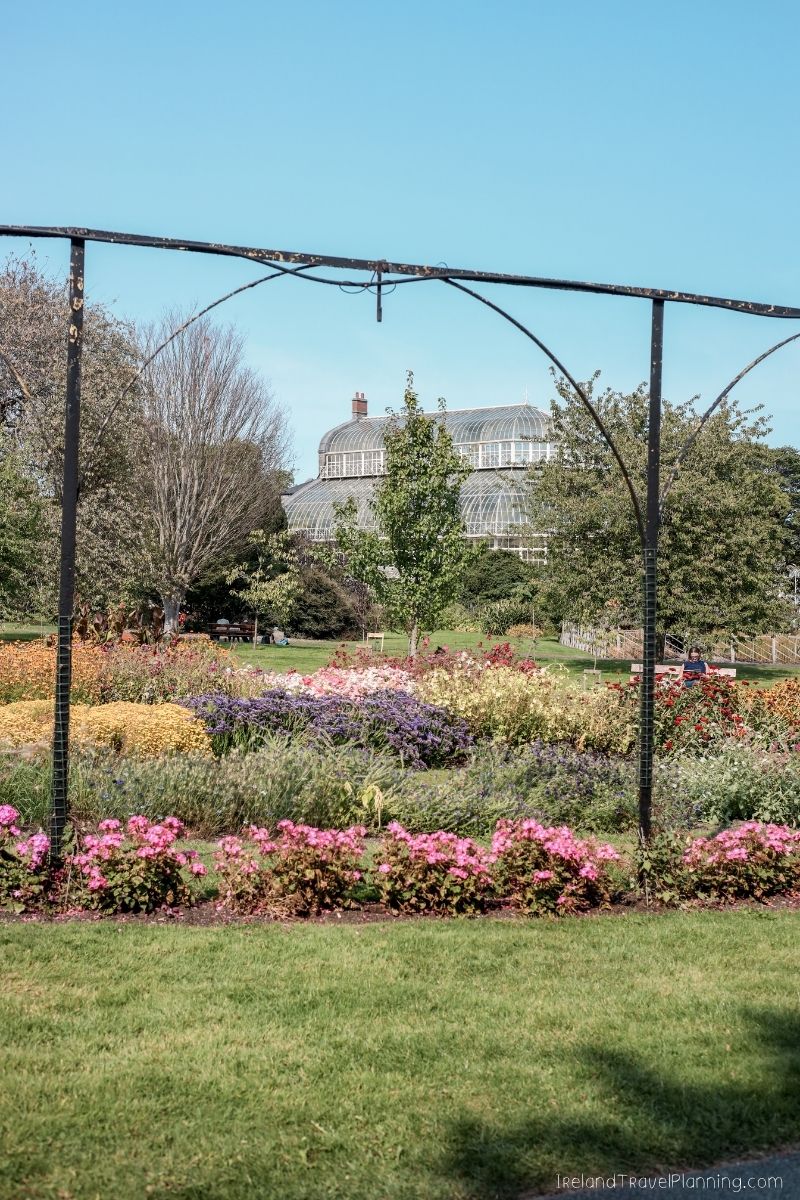 Colorful flower beds and greenhouse at the National Botanic Gardens, Dublin, a free Dublin attraction.