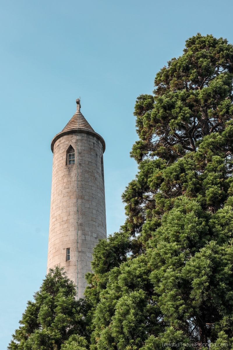 Round stone tower with conical roof and trees, a free Dublin attraction.
