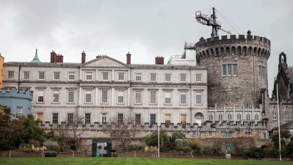 Dublin Castle view, a free thing to do in Dublin, with stone buildings and a construction crane.