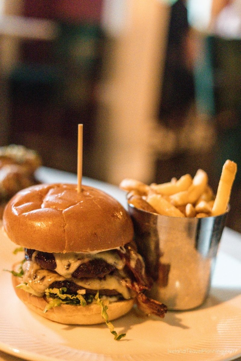 Gourmet burger and fries, a delicious food option for Ireland travel tips.