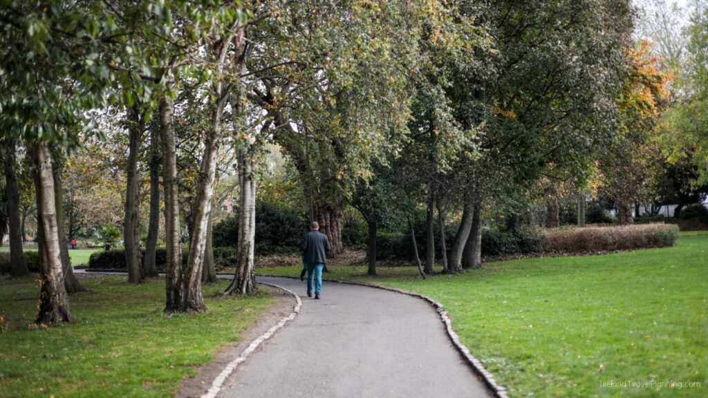Man walking along a path in Merrion Square, a free thing to do in Dublin.