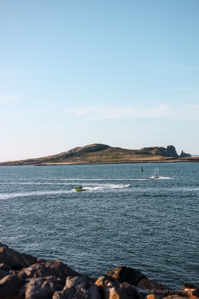 Jet ski and sailboat near Dublin's Ireland's Eye, a free Dublin attraction.