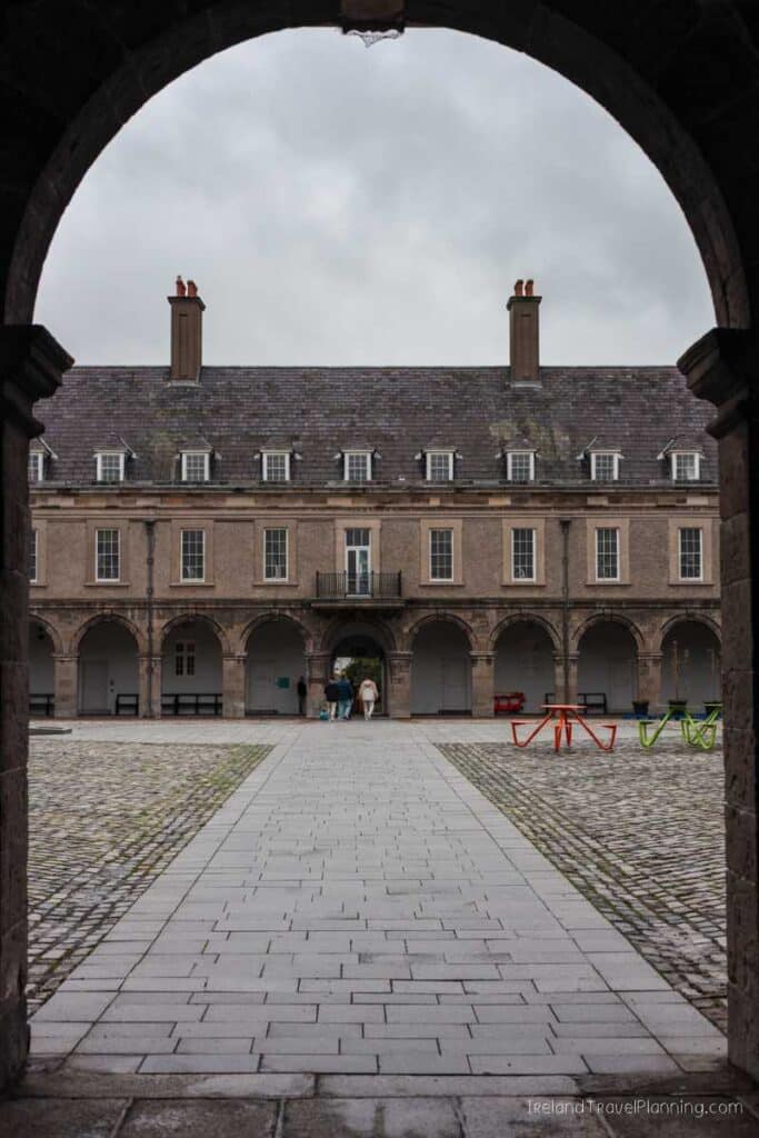 Dublin Castle courtyard view through stone archway. Free things to do in Dublin.