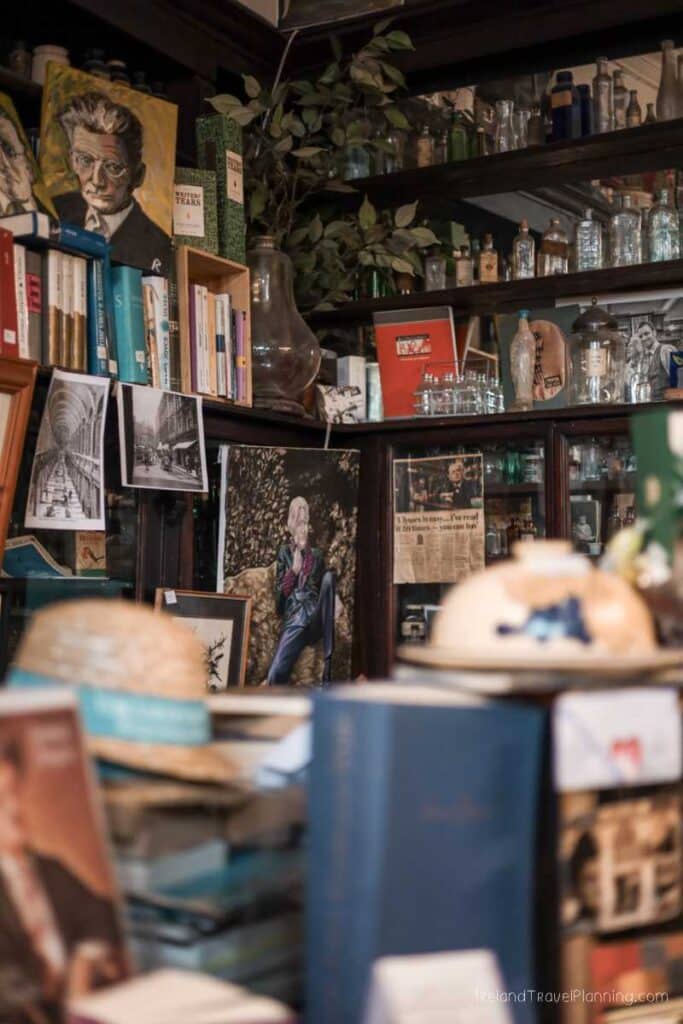 Quirky shelves filled with books, photos, and curiosities in Dublin, Ireland.