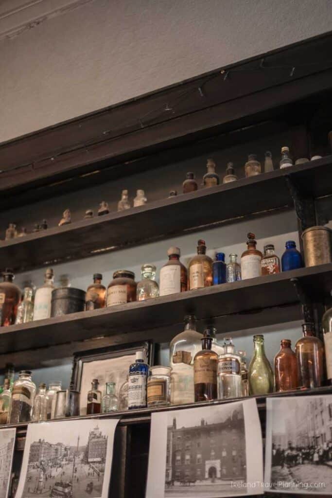 Old pharmacy bottles on shelves in Dublin, free things to do.