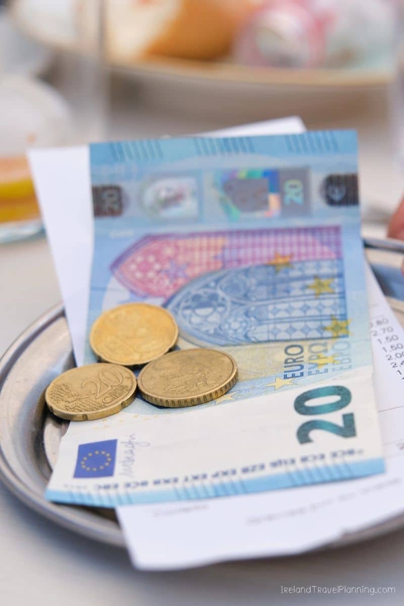 20 Euro bill and coins on a receipt, Ireland travel tip