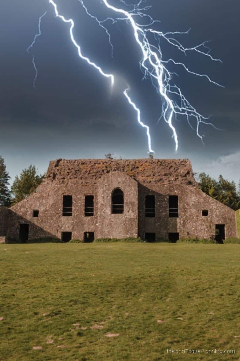 Ancient Irish ruins under a stormy sky with lightning