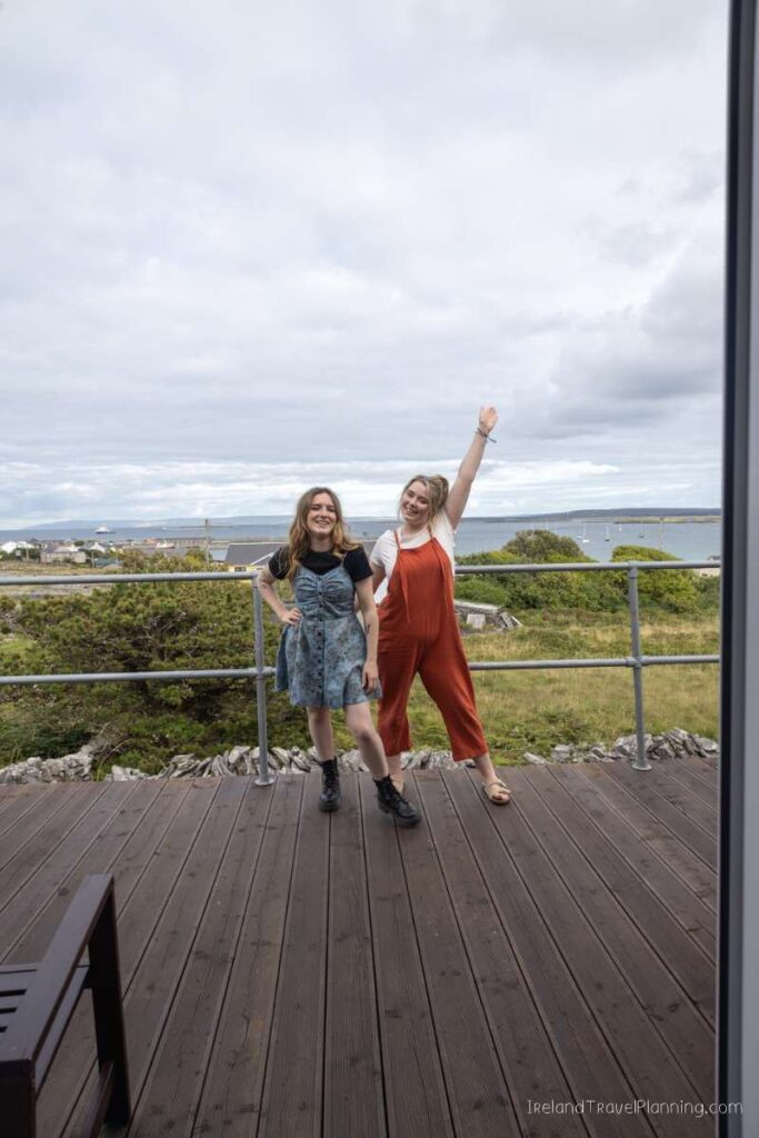 Two women on Inis Mór overlooking the coast.