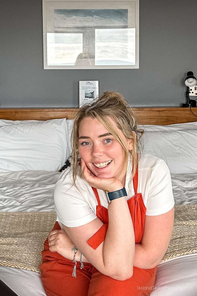 Woman smiling in Inis Mór lodging. Things to do on Inis Mór.
