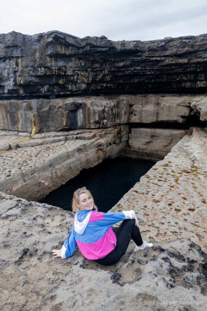 Woman at Poll na bPéist on Inis Mór, Aran Islands