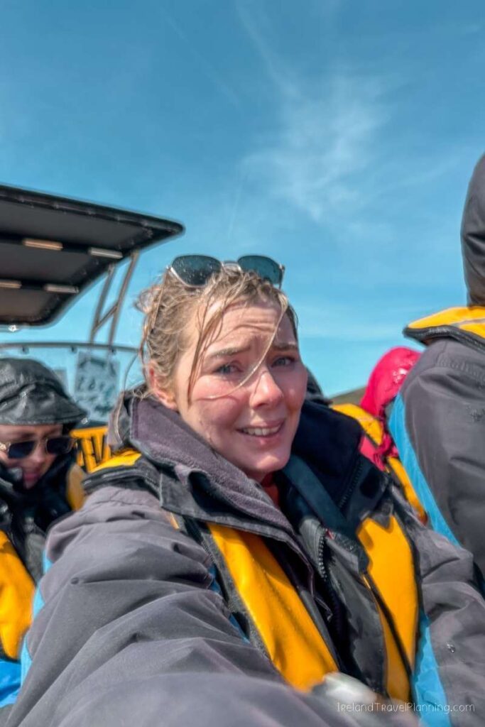 Woman on a boat tour in Kerry, Ireland, wearing a life jacket.