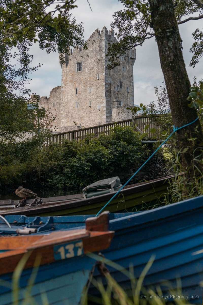 Ross Castle in Kerry, Ireland, seen from boats on the lake.