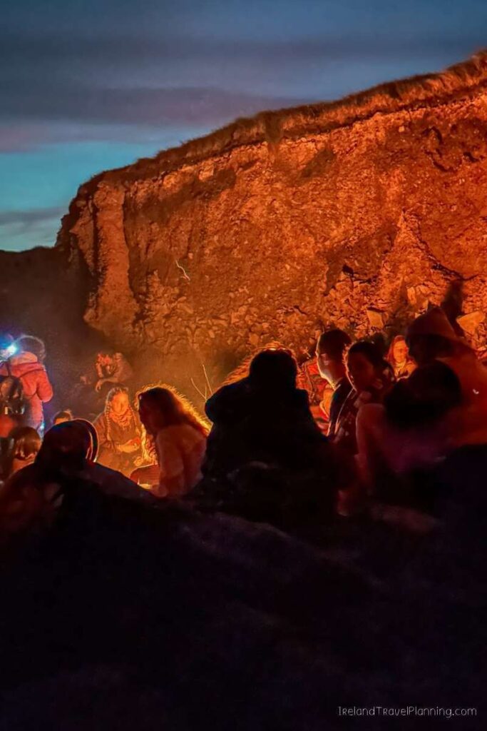 People gathered around a bonfire in Kerry, Ireland.