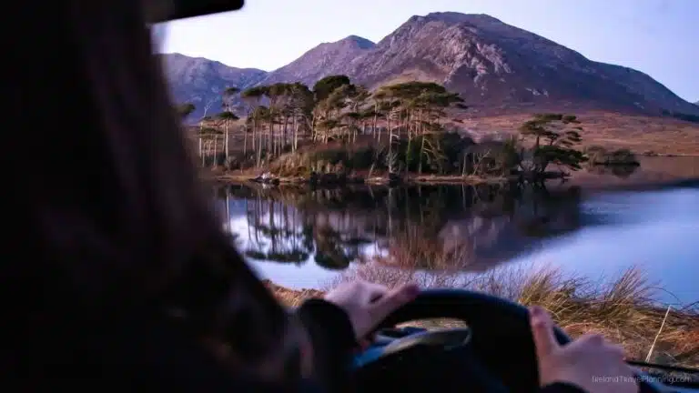 Driving in Ireland: Scenic lake view with mountains. Ideal for renting a car in Ireland.