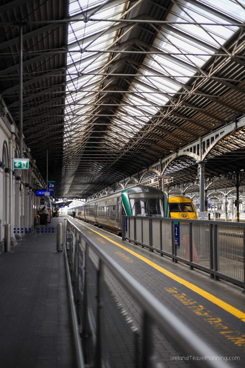 Dublin train station platform with trains, showcasing public transport in Dublin.