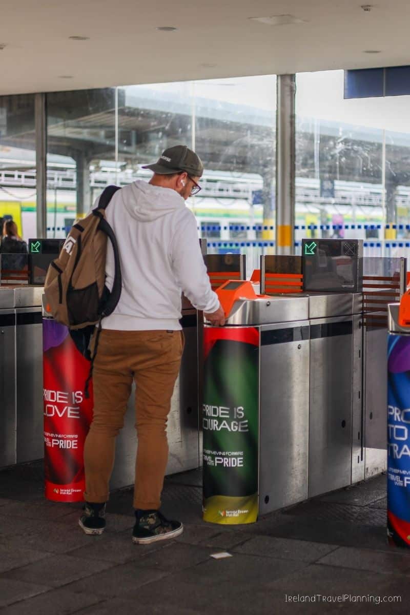 Man using public transport ticket gate in Dublin, Ireland