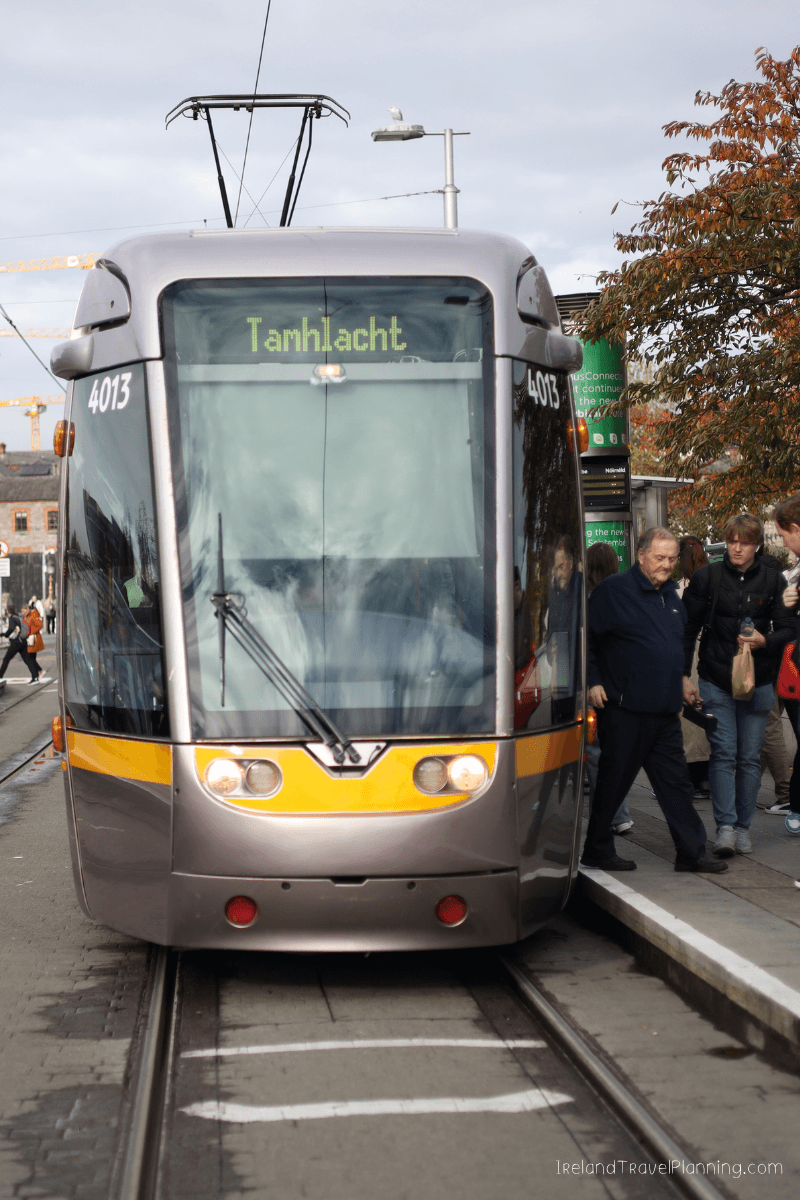 Luas tram in Dublin, showing "Tarraing" sign. Public transport in Dublin.