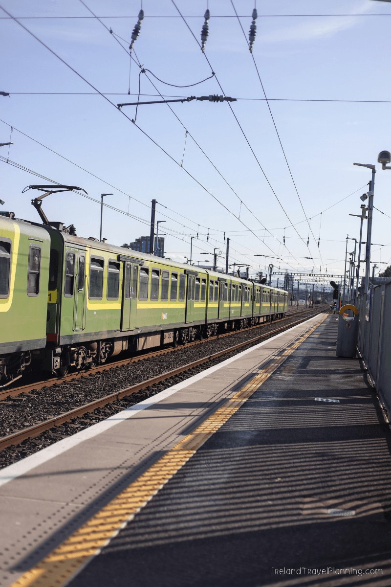 Green DART train at a Dublin station, part of public transport in Dublin