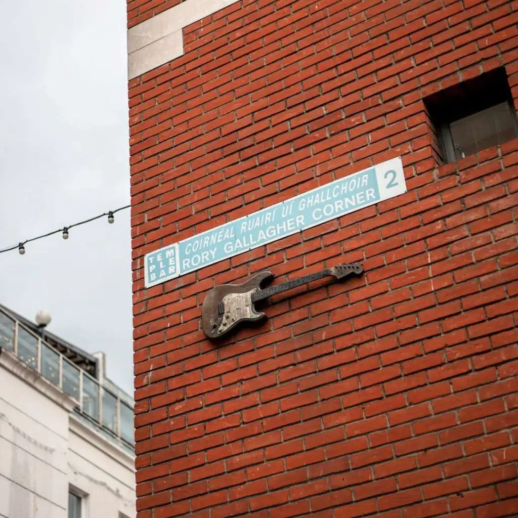 Rory Gallagher Corner street sign in Dublin with guitar art. One of Dublin's hidden gems.