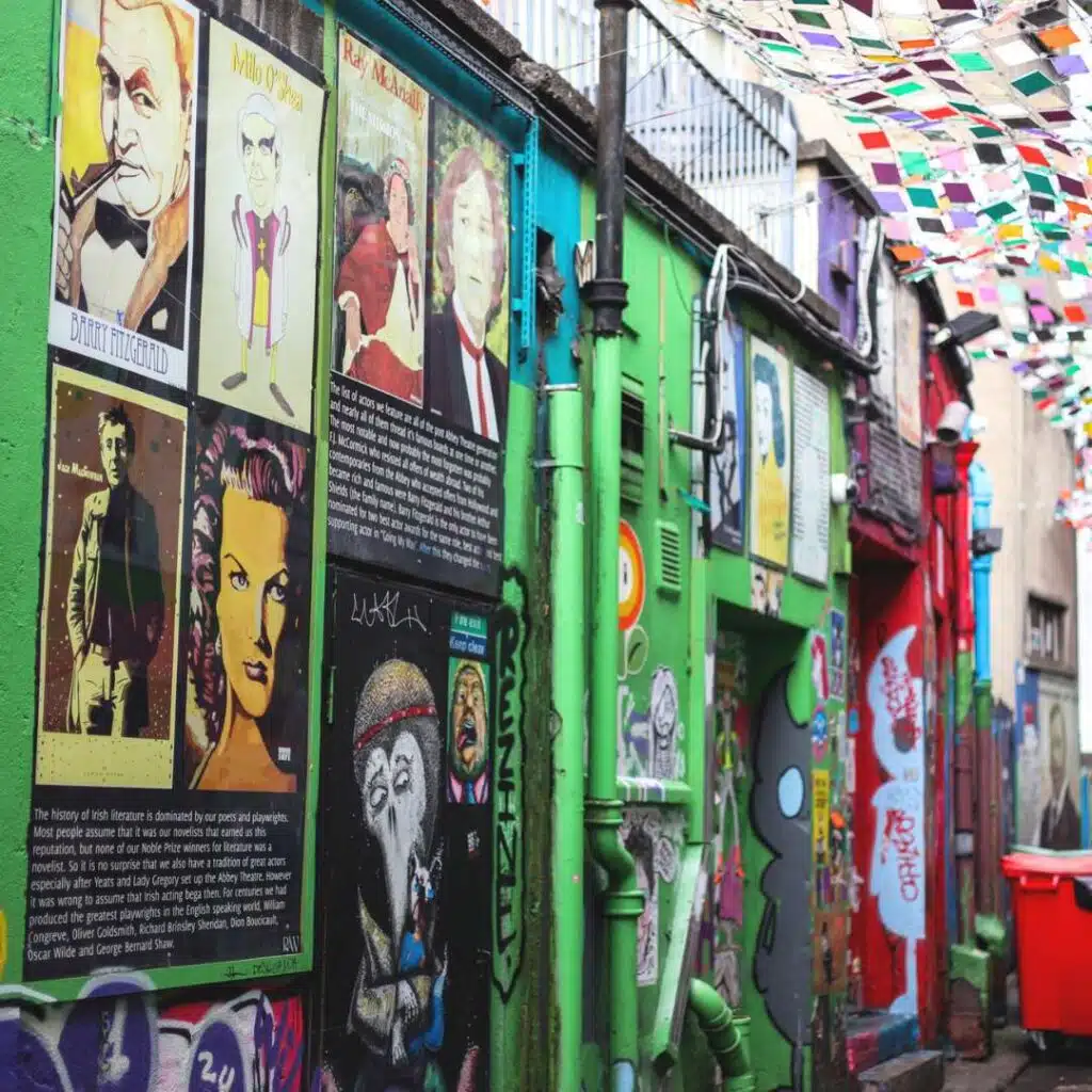 Colorful Dublin alleyway with theatre posters, a hidden gem in Dublin.