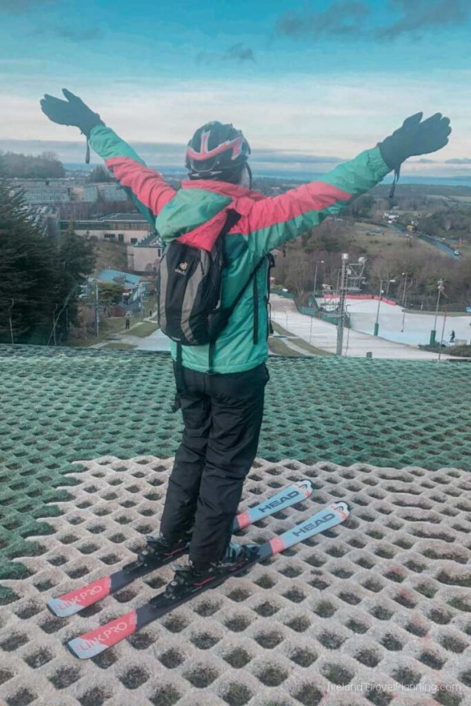 Skier with arms raised at Dublin's Ski Centre, a hidden gem in Dublin.