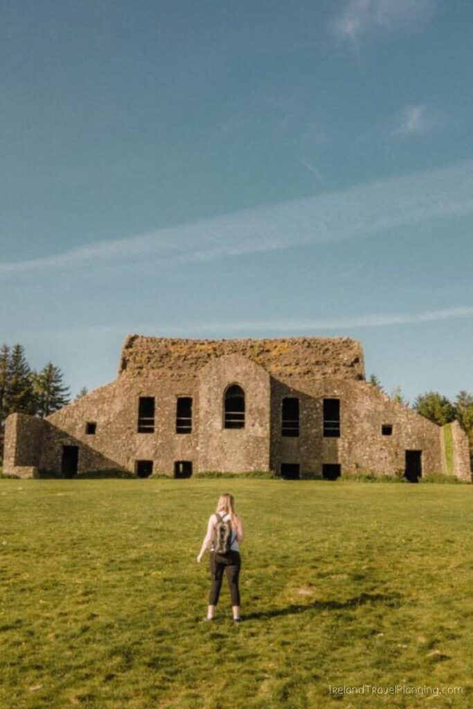 Woman exploring Hellfire Club ruins, Dublin's hidden gems.