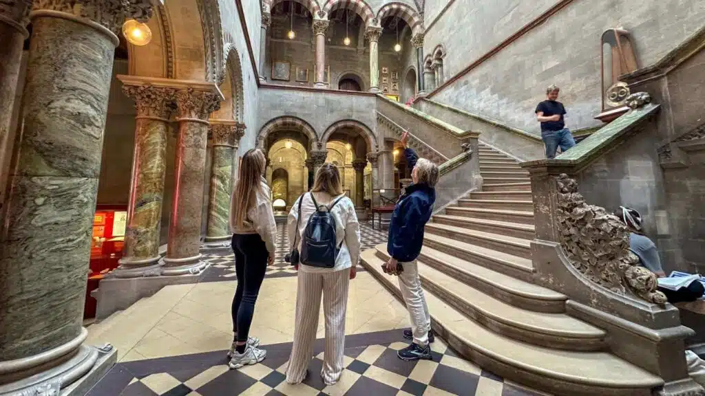 Visitors admire the ornate architecture of a hidden gem in Dublin.