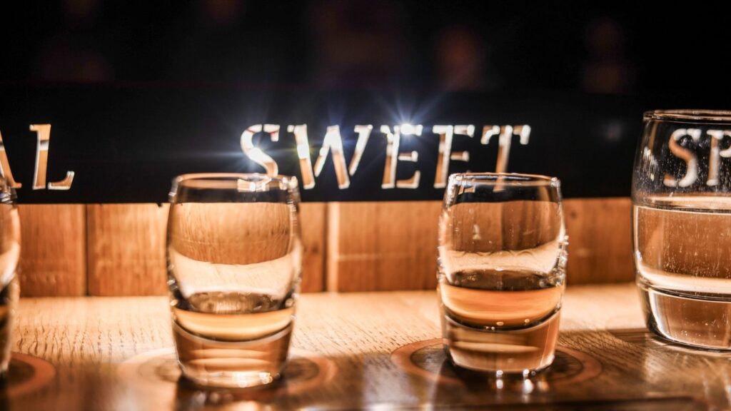 Whiskey tasting at a Dublin distillery. "Sweet" is visible in the background.