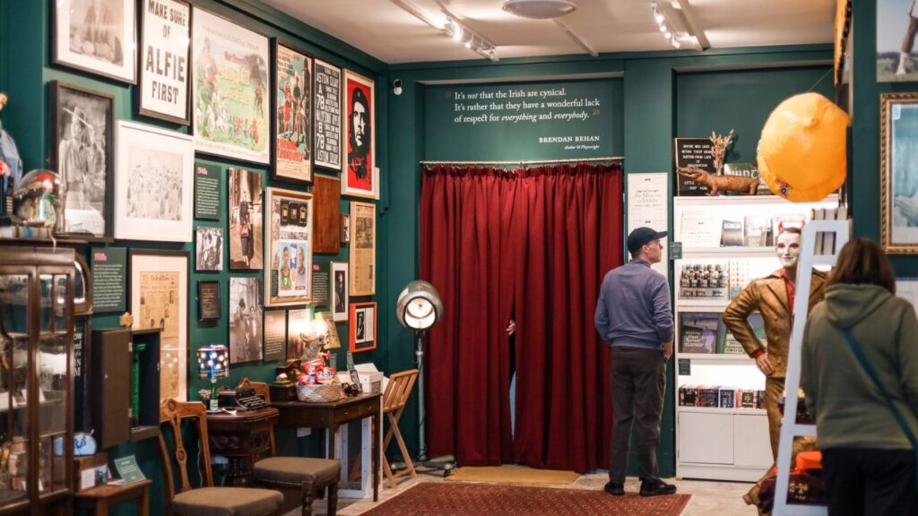 Dublin museum interior with vintage posters and artifacts, including a Brendan Behan quote.