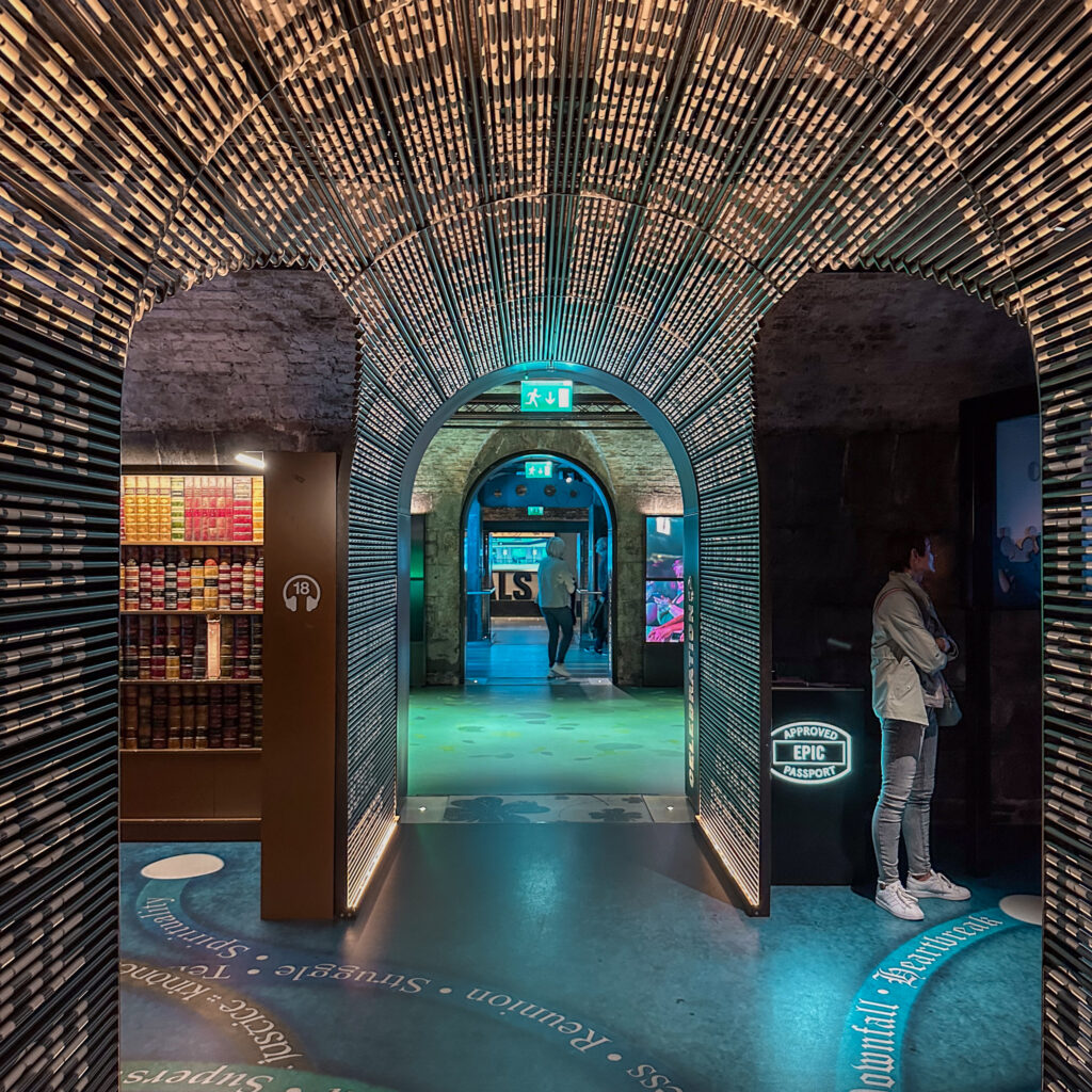 EPIC The Irish Emigration Museum interior with arched doorways and interactive exhibits.
