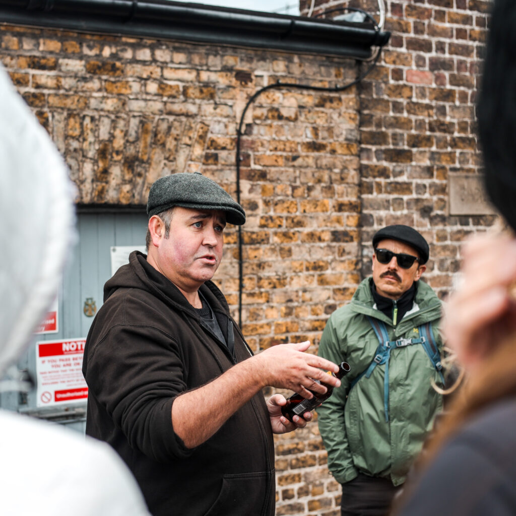 Dublin tour guide explaining something to a group of tourists.