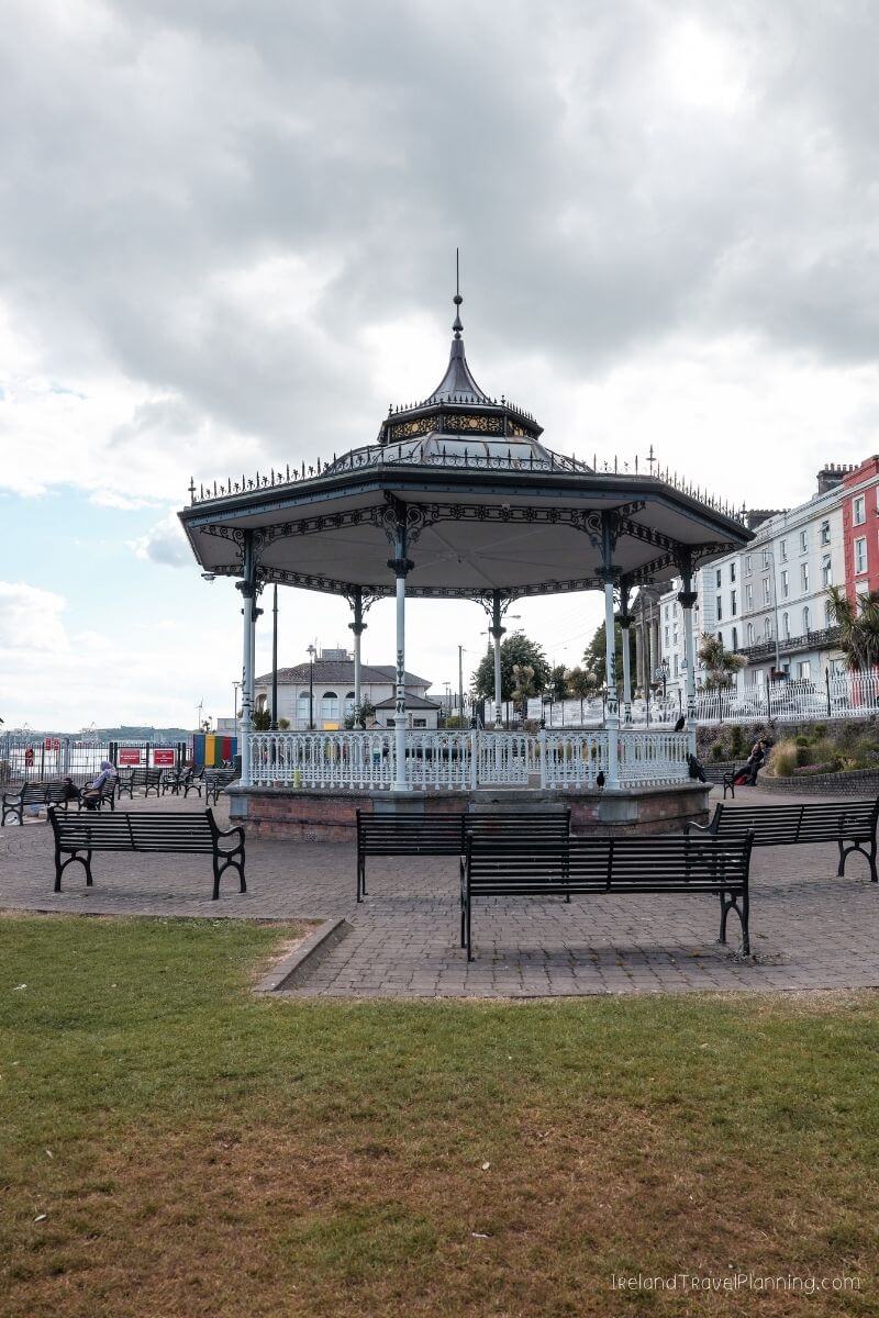 Outdoor bandstand in Cork City, surrounded by benches and grass