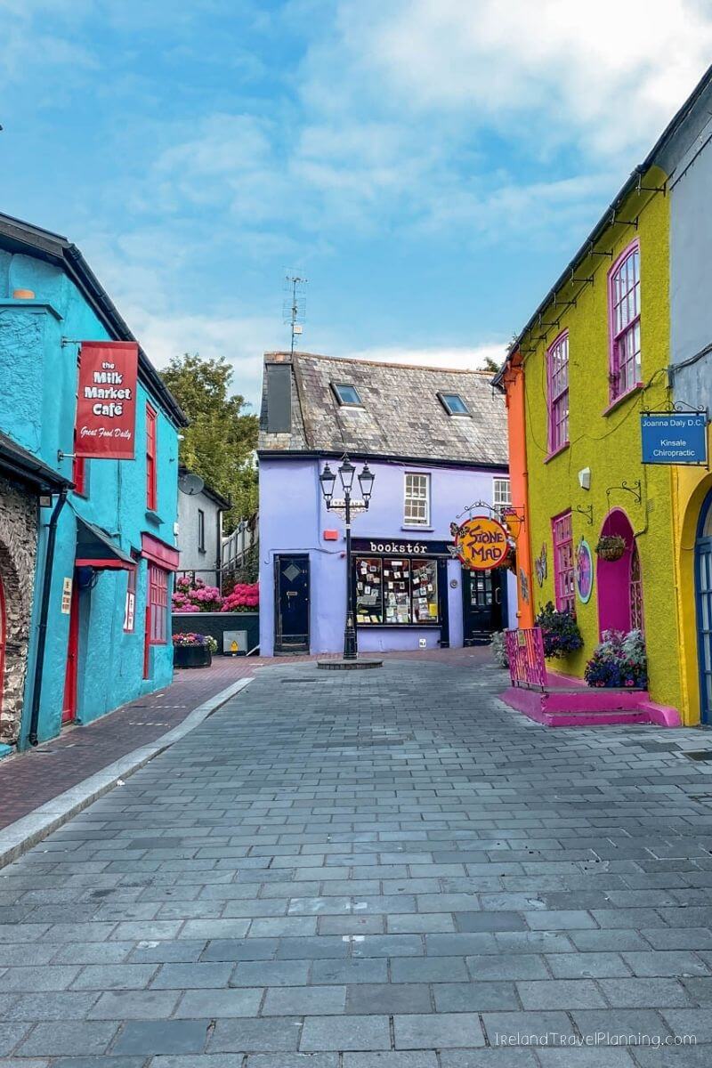 Kinsale town, colorful shops and cafes under a blue sky