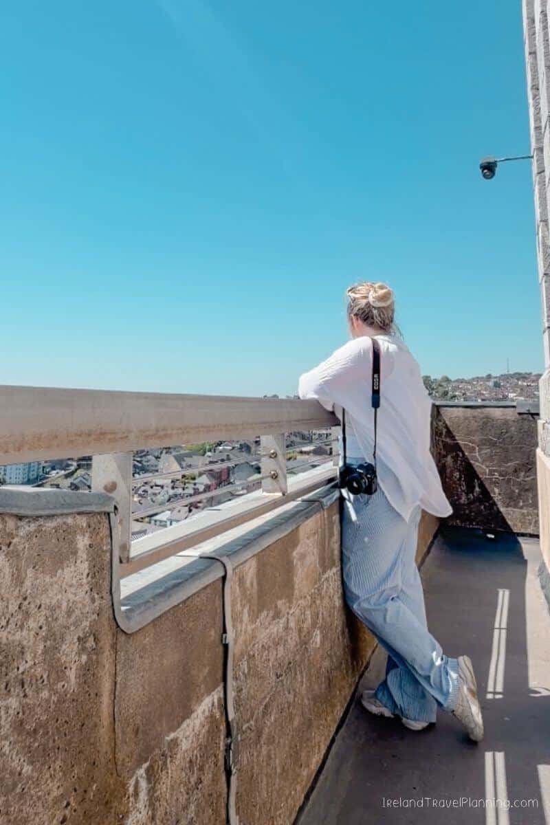 Woman looking over Cork City from a viewpoint, Ireland Travel Planning