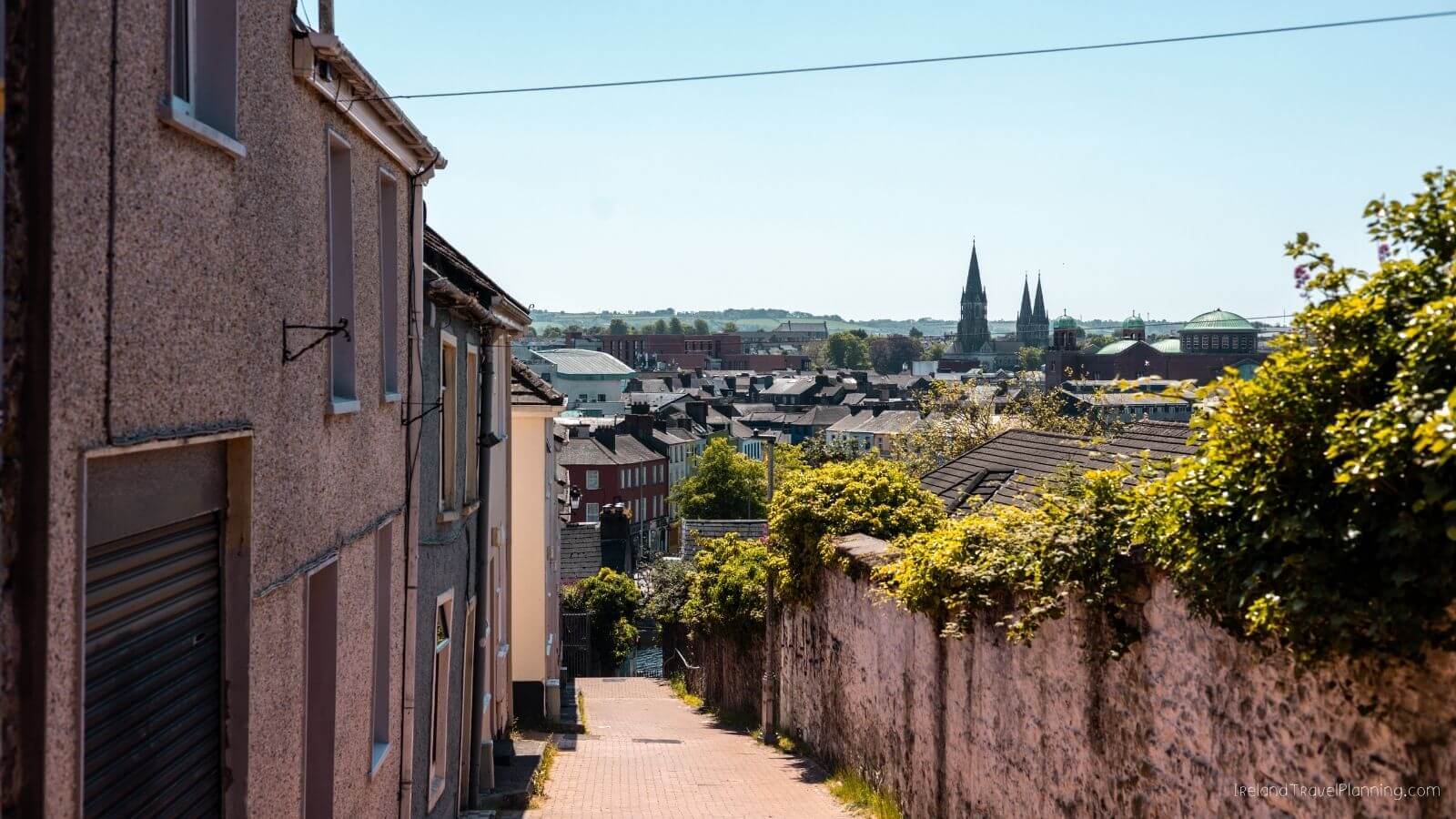 Cork City skyline with narrow street and buildings on a sunny day