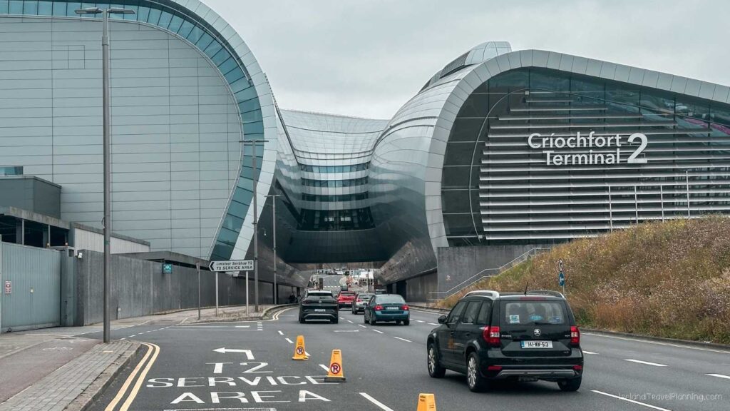 Dublin Airport Terminal 2 entrance with cars on the road