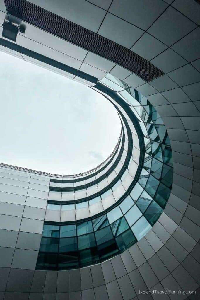 Modern architecture with curved glass facade and geometric patterns