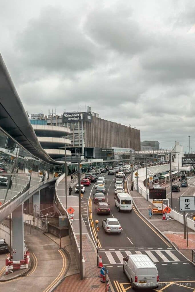 Dublin Airport Terminal 1 arrivals road with traffic and signs