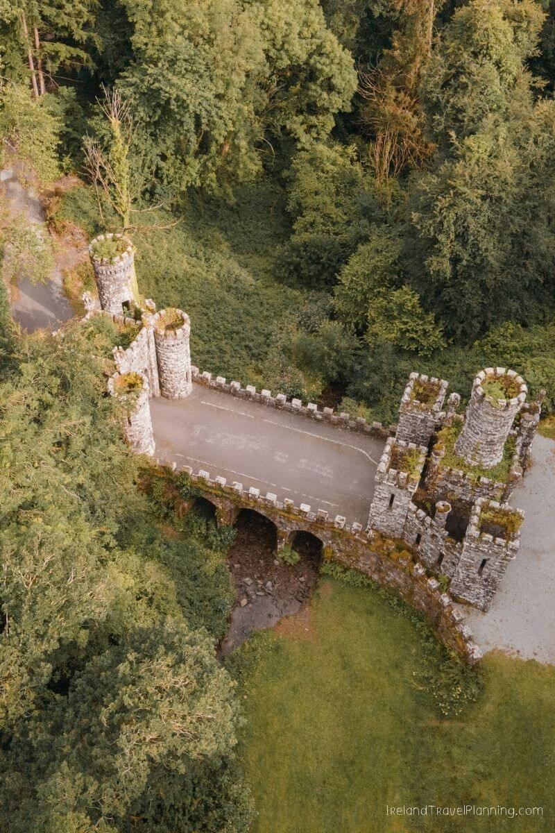 Aerial view of a stone castle gatehouse with towers, a hidden gem in Ireland.