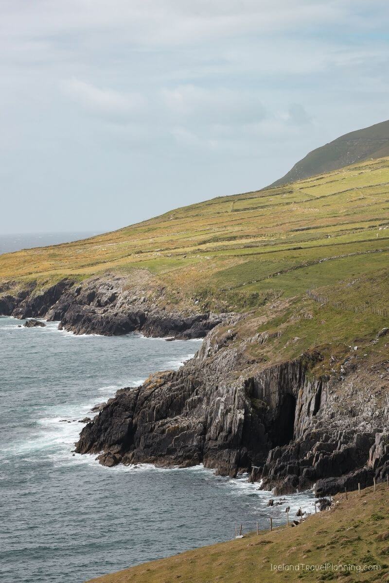 Dramatic coastal cliffs and rolling green fields in Ireland