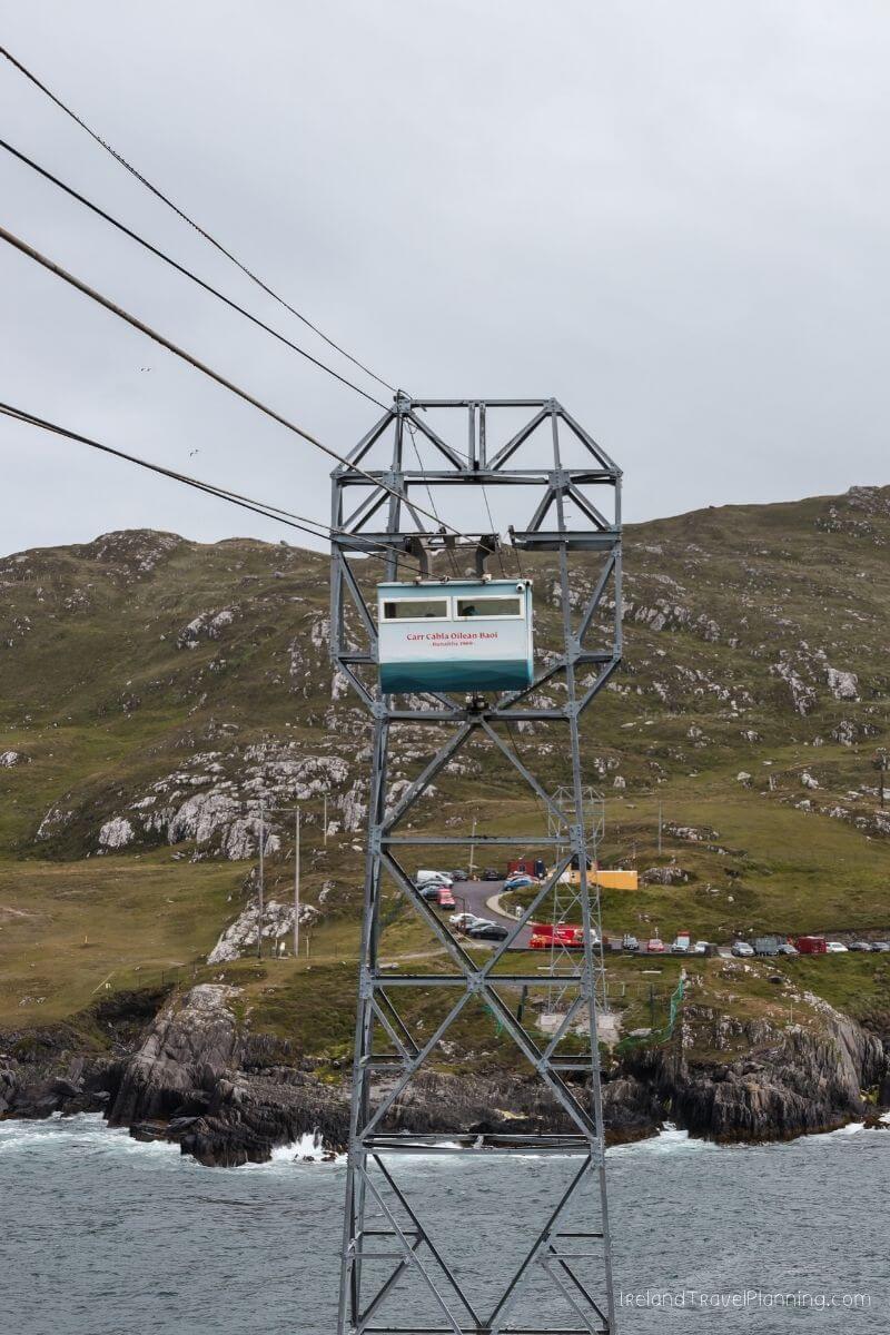 Cable car tower for Dursey Island, Ireland, with rocky coast and ocean