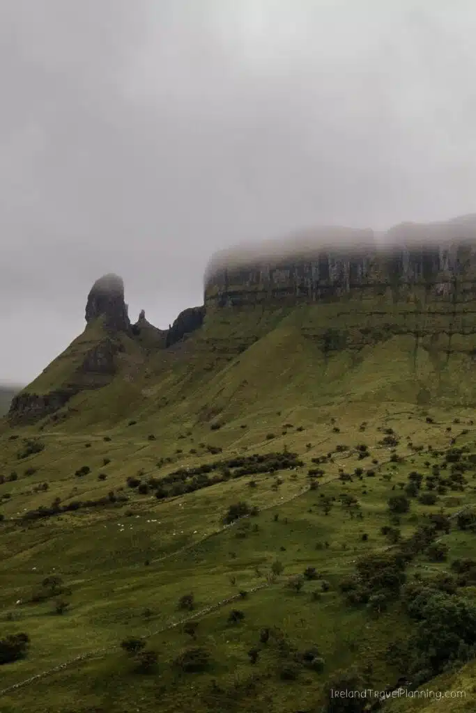 Misty Benbulben mountain in County Sligo, Ireland, with green slopes and rocky peak.
