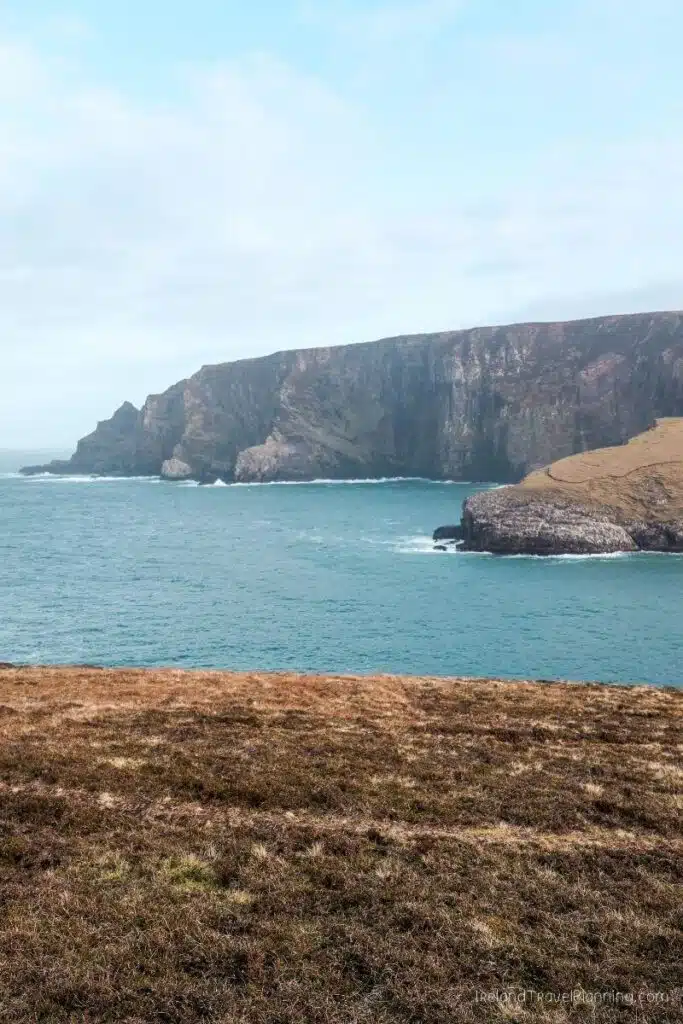 Dramatic cliffs and turquoise sea at Ireland's Wild Atlantic Way