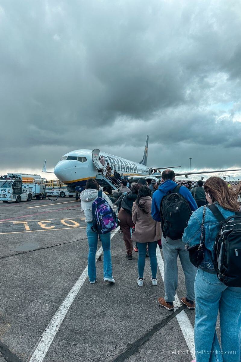 Ryanair plane boarding with passengers queuing on the tarmac