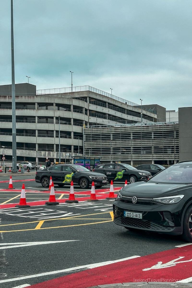 Dublin Airport taxi queue with Uber and taxi signs visible