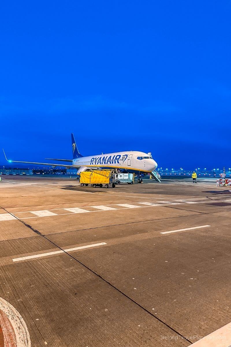 Ryanair Boeing 737 airplane at airport tarmac at dusk